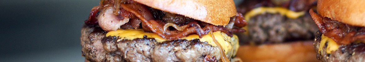Eating Burger Fast Food at Burger Mania restaurant in San Bernardino, CA.